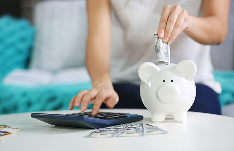 woman saving money piggy-bank